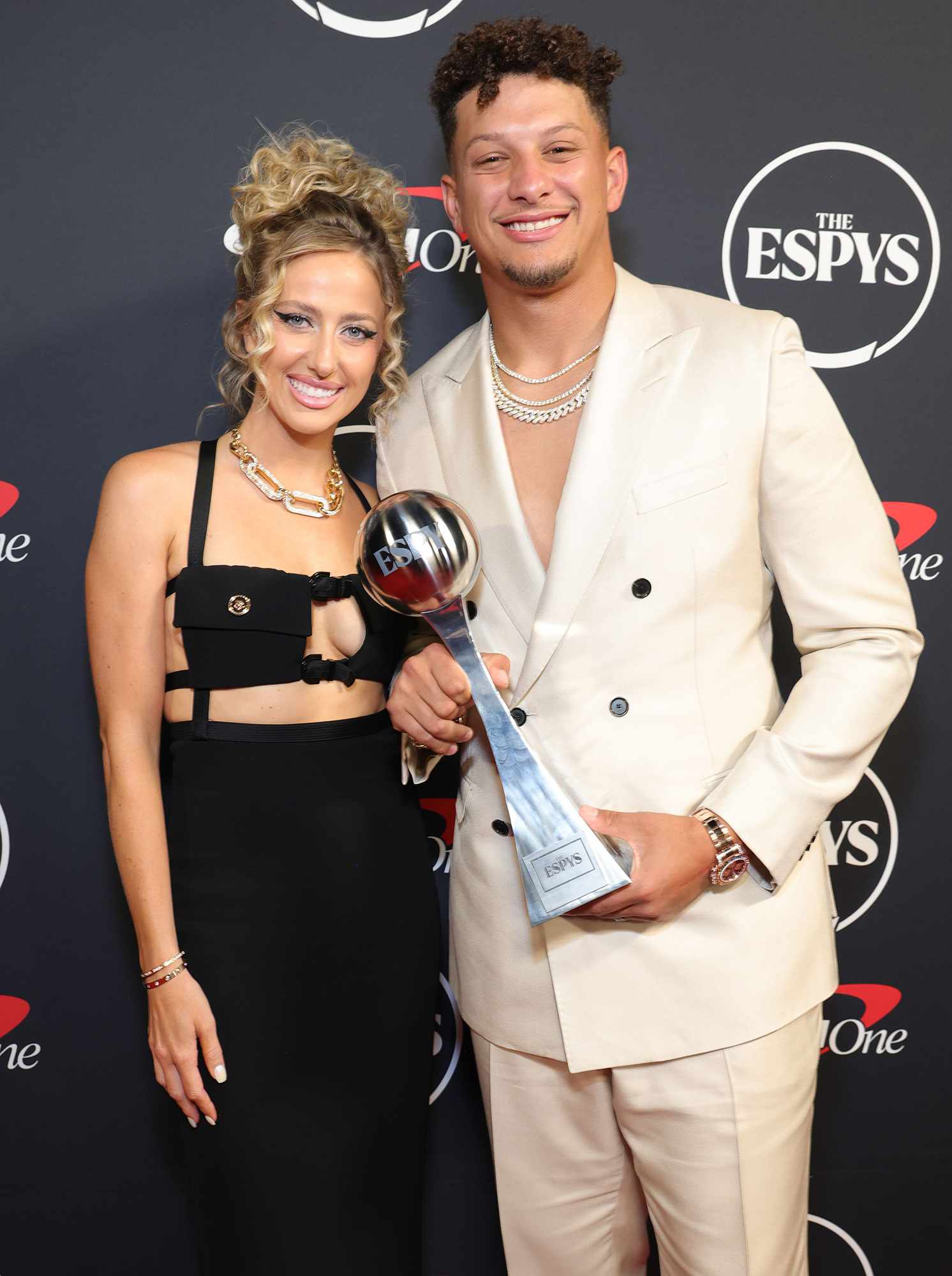 Patrick Mahomes shows off Brittany but also gets praise for his black Boss suit: The most stylish couple of the moment; The NFL star dressed to impress alongside his glamorous wife